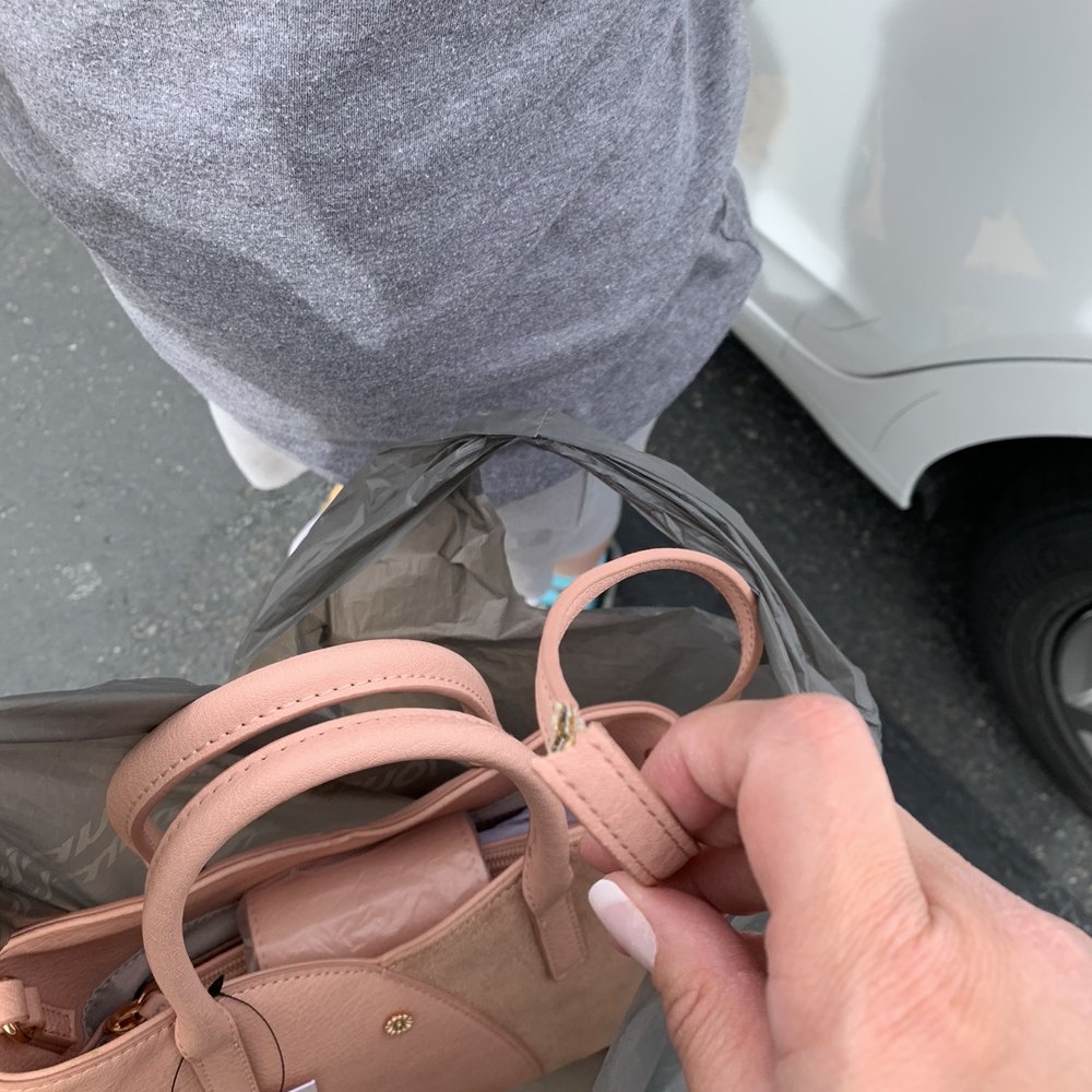 Kohl's - Im standing outside my car in the parking lot where they brought my purse I purchase and Im holding the strap. It's ripped. - Department Stores Near Me - ELK GROVE, California