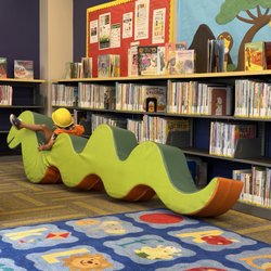 Betty Rodriguez Regional Library - Play area in the children's section: Nothing to see here. Just a construction worker taming a snake.