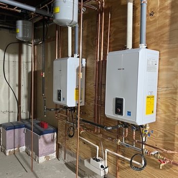 Acorn Oil - Installation of 2 Navien wall-mounted tankless combination water heaters / boilers, new expansion tank and new piping - Utilities Near Me - East Providence, Rhode Island Acorn Oil - Installation of 2 Navien wall-mounted tankless combination water heaters / boilers, new expansion tank and new piping - Utilities Near Me - East Providence, Rhode Island