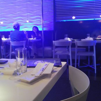 Fat Salmon - The blue lighting and Japanese wall murals are great, but table lighting is too dark.  The chairs and tables look cheap like Ikea furniture. - Japanese Near Me - Philadelphia, Pennsylvania