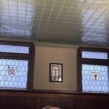 The Rathskeller - Stained glass windows, ceiling tile, and picture on wall opposite our table. - German Near Me - Indianapolis, Indiana The Rathskeller - Stained glass windows, ceiling tile, and picture on wall opposite our table. - German Near Me - Indianapolis, Indiana