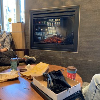 Caribou Coffee - Nice, toasty fireplace (excuse the clutter from the people around me)! - Coffee & Tea Near Me - Minneapolis, Minnesota