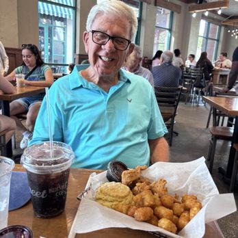 Maple Street Biscuit Company - Husband with chicken tenders, biscuit and tots - yummy! - Breakfast & Brunch Near Me - Celebration, Florida Maple Street Biscuit Company - Husband with chicken tenders, biscuit and tots - yummy! - Breakfast & Brunch Near Me - Celebration, Florida
