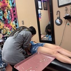Body Revolution Tattoos & Body Piercings - Getting belly pierced