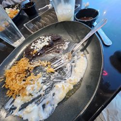 Empty plate of sour creme enchiladas