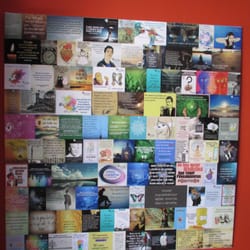 Albergue Porta de Santiago - A wallboard, in the lobby, with photos and quotes.