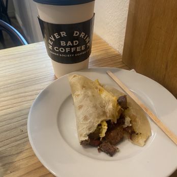 Honor Society - Coco loco latte with Almond milk. Yummy!  Breakfast taco with brisket. Very good! - Coffee Roasteries Near Me - Tomball, Texas