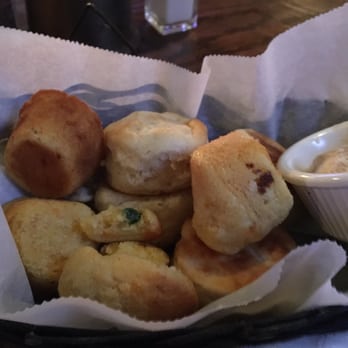 Saddle Ranch - Buttermilk biscuits & jalapeño cheddar cornbread served with butter that tasted like it had cinnamon sugar in it. Very yummy, warm and soft - Steakhouses Near Me - Orange, California