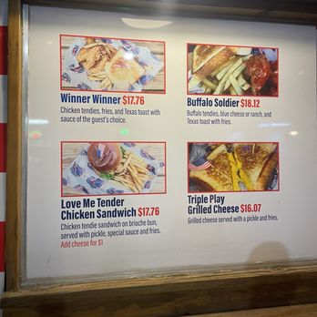 BK Backyard Bar - Menu - A menu board features four food items: Winner Winner, Buffalo Soldier, Love Me Tender Chicken Sandwich, and Triple Play Grilled Cheese, each with images, descriptions, and prices. - Bars Near Me - Brooklyn, New York