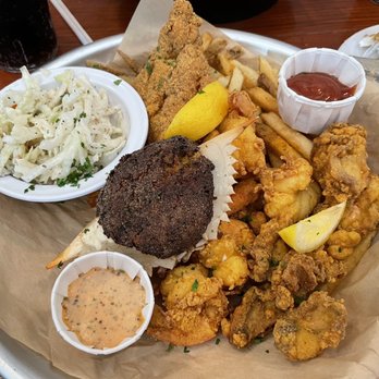 The Parish - Fried seafood platter. Oysters. Shrimp. Stuffed crab. Fried catfish. Served with fries and coleslaw - Live/Raw Food Near Me - Hernando, Mississippi
