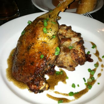 Roots Restaurant and Bar - Duck confit with cranberry pear bread pudding and black pepper honey - New American Near Me - Camas, Washington Roots Restaurant and Bar - Duck confit with cranberry pear bread pudding and black pepper honey - New American Near Me - Camas, Washington