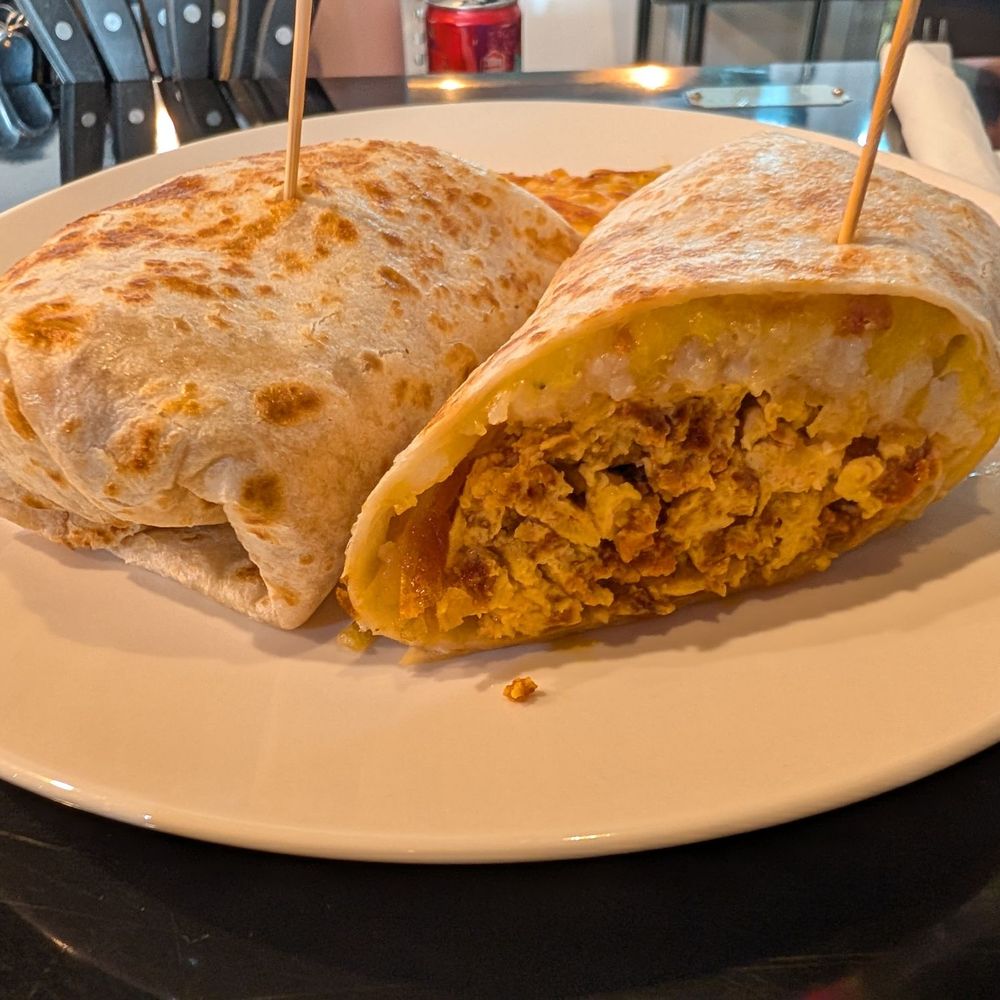 Chorizo breakfast burrito. So yummy, especially with the green sauce. Chorizo breakfast burrito. So yummy, especially with the green sauce.