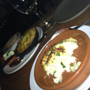 ZuZu - Tortilla espanola in a cast iron skillet and 1/2 eaten bacalao gratin - Tapas Bars Near Me - Napa, California ZuZu - Tortilla espanola in a cast iron skillet and 1/2 eaten bacalao gratin - Tapas Bars Near Me - Napa, California
