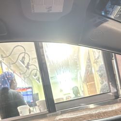 Zaxbys - Multiple females not doing their job; lots of laughing and playing around.
