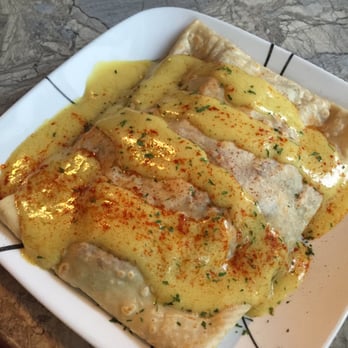 Crepe Creation Cafe - Spinach, bacon, baby bella and egg crépe smothered in hollandaise - Creperies Near Me - Myrtle Beach, South Carolina