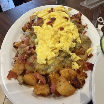 Stack's Cafe - Stacked! Country potatoes! Delicious, Flavorful chilie verde, scrambled egged sprinkled with freshly cooked chopped bacon! - Breakfast & Brunch Near Me - Bakersfield, California Stack's Cafe - Stacked! Country potatoes! Delicious, Flavorful chilie verde, scrambled egged sprinkled with freshly cooked chopped bacon! - Breakfast & Brunch Near Me - Bakersfield, California