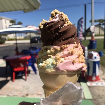 Beachside Creamery - a hand holding a cone of ice cream - Ice Cream & Frozen Yogurt Near Me - Melbourne Beach, Florida Beachside Creamery - a hand holding a cone of ice cream - Ice Cream & Frozen Yogurt Near Me - Melbourne Beach, Florida
