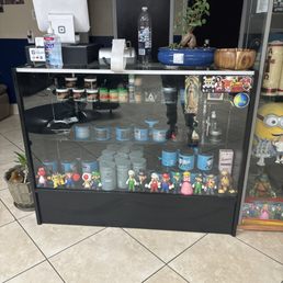 Pretty nice barber shop and on the counter they have Mario characters and gel Pretty nice barber shop and on the counter they have Mario characters and gel