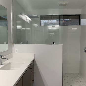 AGD Construction - a large bathroom with a walk in shower - General Contractors Near Me