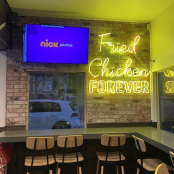 Bruxie - a neon sign that reads fried chicken forever - Chicken Shop Near Me - Long Beach, California