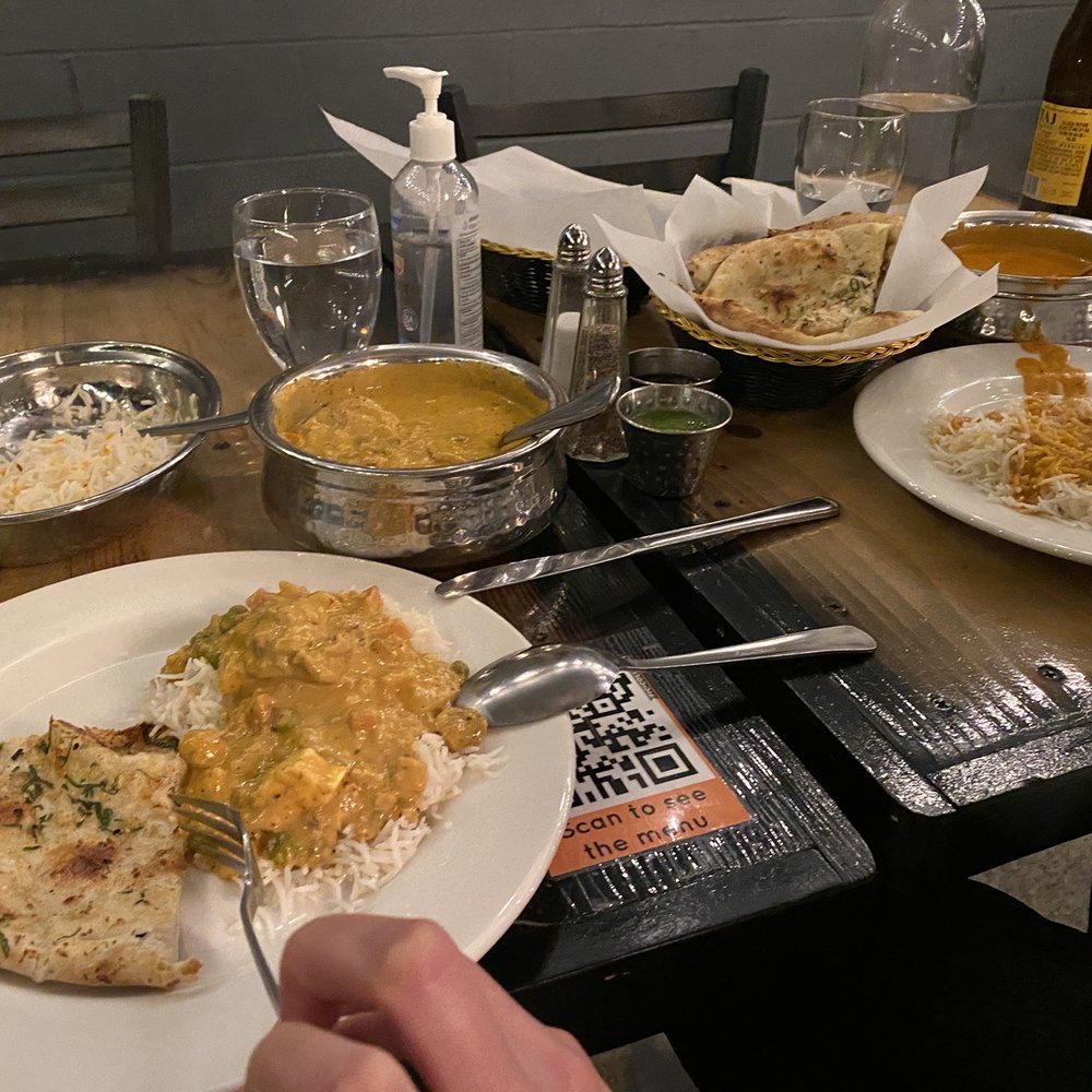India Palace - Left - vegetarian korma, right - chicken tikka masala. Paneer naan with garlic. All very delicious! - Indian Near Me - Alameda, California