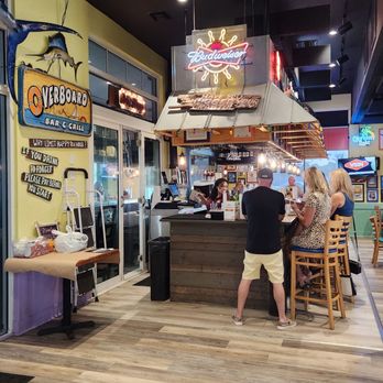Pinchers - a man and a woman eating at a restaurant - Seafood Near Me - Venice, Florida