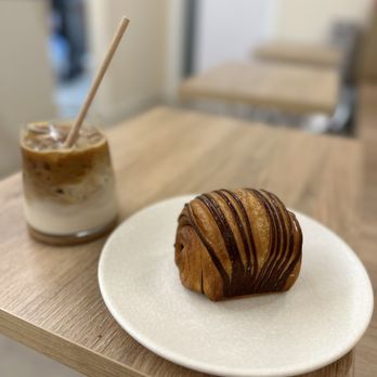 brew coffee - Iced latte and chocolate croissant - Coffee & Tea Near Me