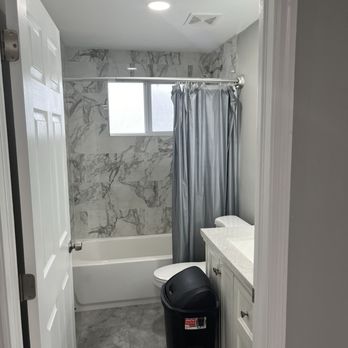 Elite Way Window Tinting - Marble wall, frost tinted impact window, toilet and bathtub. - Home Window Tinting Near Me Elite Way Window Tinting - Marble wall, frost tinted impact window, toilet and bathtub. - Home Window Tinting Near Me