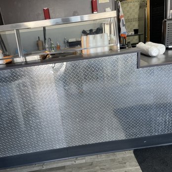 Berea Smokehouse - a stainless steel counter with a checkered pattern - Barbeque Near Me - Berea, Ohio Berea Smokehouse - a stainless steel counter with a checkered pattern - Barbeque Near Me - Berea, Ohio