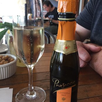 Benchmark Eatery - I ordered a glass of prosecco and was served this little bottle. It was just okay and expensive. - New American Near Me - Santa Barbara, California