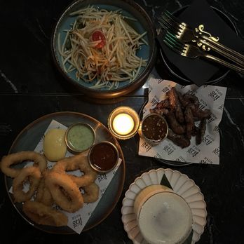 Noir Bar - Papaya salad, beef jerky, and calamari - Bars Near Me - Orlando, Florida