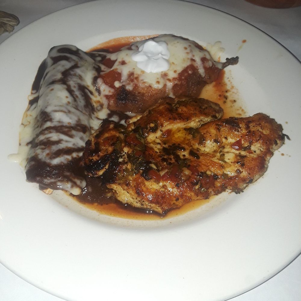 Que Rico - Que Rico combo. Includes a chicken breast with chimichurri. 1 chicken mole enchilada and a Chile relleno. Yum! - Mexican Near Me - Chicago, Illinois Que Rico - Que Rico combo. Includes a chicken breast with chimichurri. 1 chicken mole enchilada and a Chile relleno. Yum! - Mexican Near Me - Chicago, Illinois