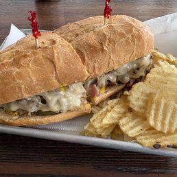 Cubano Sandwich - Ham, Smoked Pork, Yellow Mustard, and Pickles on a French Roll with Chips