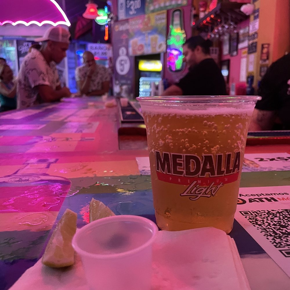 This a medalla with some lime and salt ready to enjoy the night This a medalla with some lime and salt ready to enjoy the night