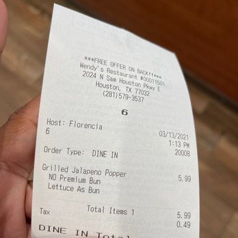 Wendy's - a person holding a receipt - Fast Food Near Me - Houston, Texas Wendy's - a person holding a receipt - Fast Food Near Me - Houston, Texas