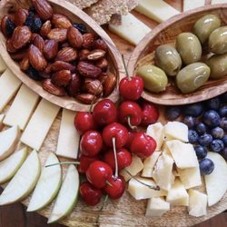 The Rind & Truckle - Evelyn's crackers, cheeses, provisions cheddar thyme shortbread, garlic stuffed olives and cocktail nuts.