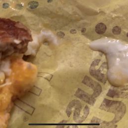 This is the other sandwich with raw egg dripping out of it