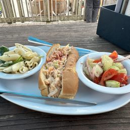 Lobster roll with two delicious sides Lobster roll with two delicious sides