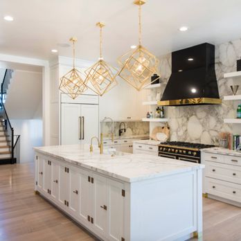 Carter Home Remodeling - a kitchen with white cabinets and marble countertops - General Contractors Near Me - San Leandro, California Carter Home Remodeling - a kitchen with white cabinets and marble countertops - General Contractors Near Me - San Leandro, California