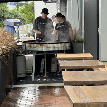 Como Taperia - Cooking paella - Tapas Bars Near Me - Vancouver, British Columbia