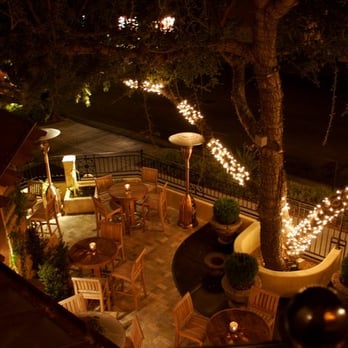 Hotel Cheval - A view down on the bar patio from the upstairs seating area at Hotel Cheval. - Hotels Near Me - Paso Robles, California Hotel Cheval - A view down on the bar patio from the upstairs seating area at Hotel Cheval. - Hotels Near Me - Paso Robles, California