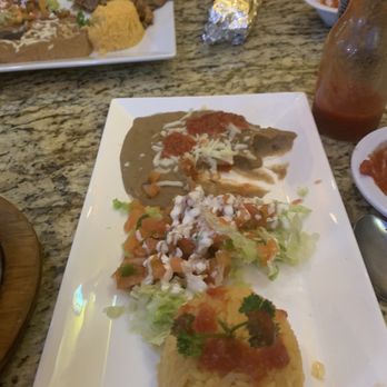 Hidalgo Bar and Grill - Side dishes... rice, pico de gallo, and refried beans - Bars Near Me - Augusta, Kansas