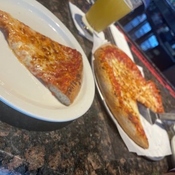 Tailgaters and Il Primo - two slices of pizza on plates - Pizza Near Me - Peoria, Arizona Tailgaters and Il Primo - two slices of pizza on plates - Pizza Near Me - Peoria, Arizona