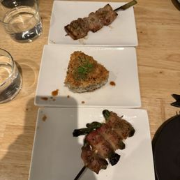 onigiri, pork belly skewer, bacon wrapped shishito preppers onigiri, pork belly skewer, bacon wrapped shishito preppers