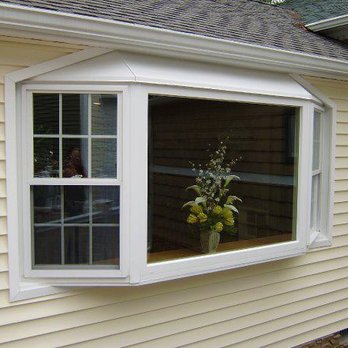 Miracle Home Improvements - a window with a vase of flowers in it - General Contractors Near Me - Croton-On-Hudson, New York Miracle Home Improvements - a window with a vase of flowers in it - General Contractors Near Me - Croton-On-Hudson, New York