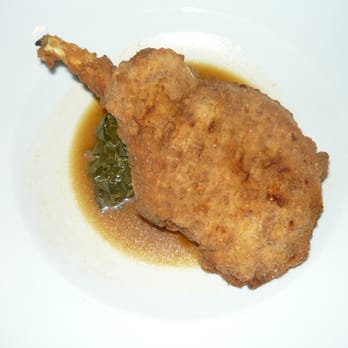 Anson - Double cut Southern fried pork chop on collard greens. - Seafood Near Me - Charleston, South Carolina