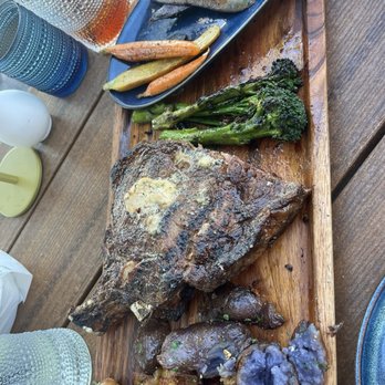 Boardwalk Bar & Grill - Ribeye after we cut almost 1/2 off, & a side of rainbow carrots - Seafood Near Me - Indialantic, Florida Boardwalk Bar & Grill - Ribeye after we cut almost 1/2 off, & a side of rainbow carrots - Seafood Near Me - Indialantic, Florida