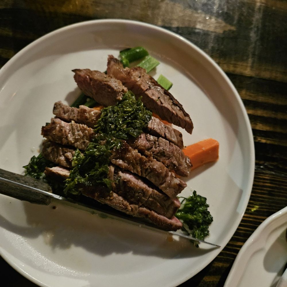 Crafted Cocktail Co. - "CHIMICHURRI STEAK": Petit wet-aged premium cut, seared and sliced, house chimichurri, farm-fresh vegetables - Cocktail Bars Near Me - Richmond Hill, Georgia
