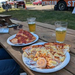 Slices of pepperoni and Hawaiian Slices of pepperoni and Hawaiian