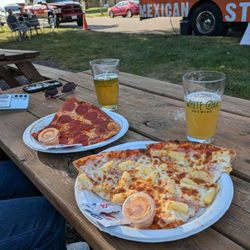 Artesanos Pizza - Slices of pepperoni and Hawaiian